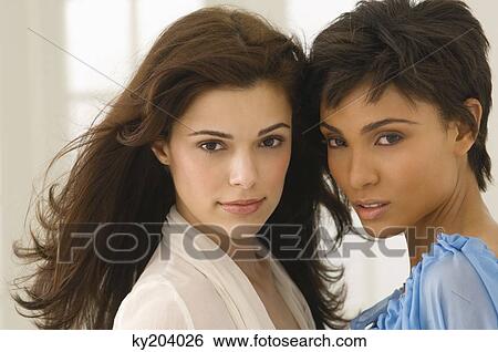 Stock Photograph - Portrait of two female friends. Fotosearch