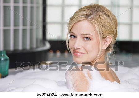 Woman taking a bubble bath View Large Photo Image Picture - Woman taking a bubble bath. Fotosearch