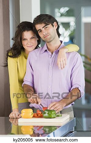 Man cutting bell pepper and smiling View Large Photo Image Stock Photography - Man cutting bell pepper and smiling. Fotosearch