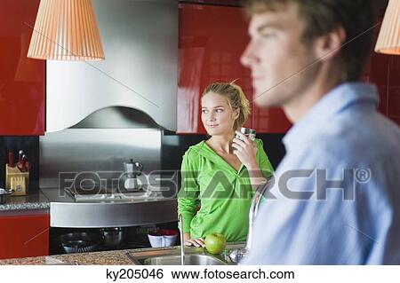 Woman holding a glass of water View Large Photo Image Stock Photograph - Woman holding a glass of water. Fotosearch