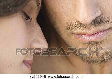 Close-up of a couple View Large Photo Image Stock Photograph - Close-up of a couple. Fotosearch