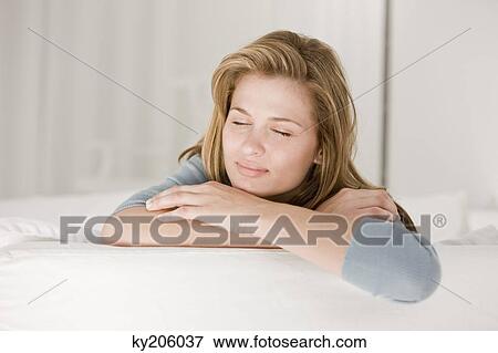 Close-up of a woman napping View Large Photo Image Stock Photo - Close-up of a woman napping. Fotosearch