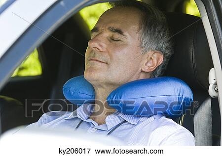 Man sleeping in a car View Large Photo Image Stock Photo - Man sleeping in a car. Fotosearch
