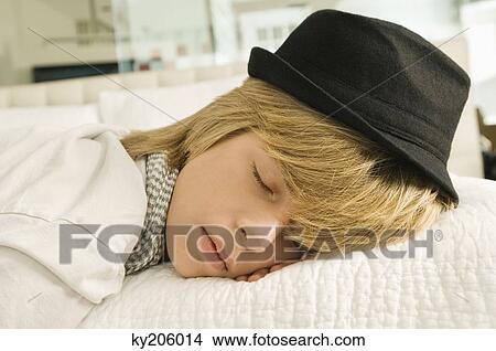 Teenage boy sleeping on the bed View Large Photo Image Picture - Teenage boy sleeping on the bed. Fotosearch