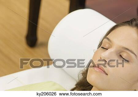 Woman lying on the bed View Large Photo Image Stock Photograph - Woman lying on the bed. Fotosearch