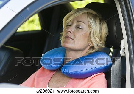 Woman sleeping in a car View Large Photo Image Stock Image - Woman sleeping in a car. Fotosearch