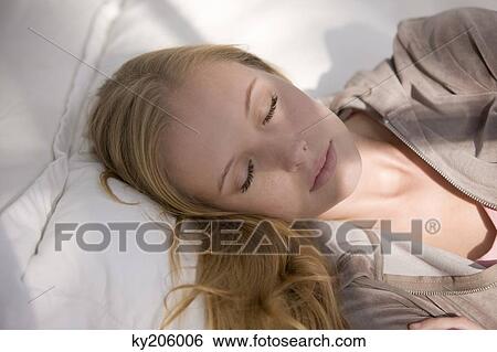 Woman sleeping on the bed View Large Photo Image Stock Photograph - Woman sleeping on the bed. Fotosearch
