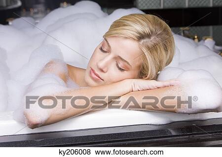 Woman taking a bubble bath View Large Photo Image Stock Photo - Woman taking a bubble bath. Fotosearch