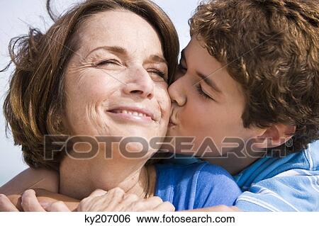 Boy kissing his grandmother View Large Photo Image Stock Photograph - Boy kissing his grandmother. Fotosearch