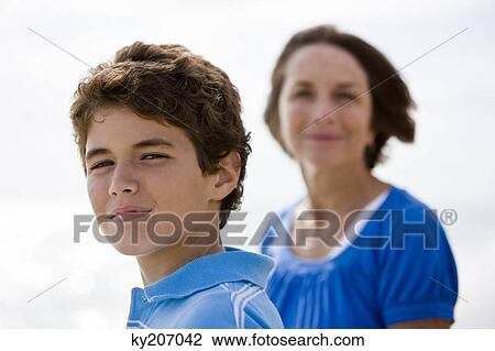 Boy with his grandmother on the beach View Large Photo Image Stock Image - Boy with his grandmother on the beach. Fotosearch