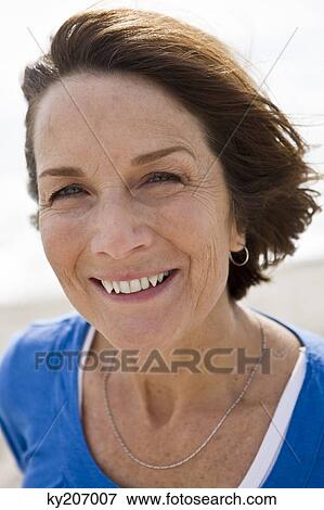 Stock Photo - Portrait of a woman smiling. Fotosearch