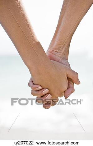 Woman and her grandson holding hands View Large Photo Image Stock Image - Woman and her grandson holding hands. Fotosearch
