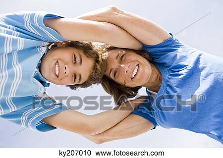 Stock Image - Woman and her grandson huddle together. Fotosearch