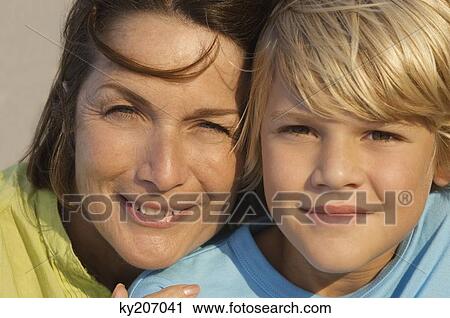 Woman smiling with her grandson View Large Photo Image Stock Image - Woman smiling with her grandson. Fotosearch