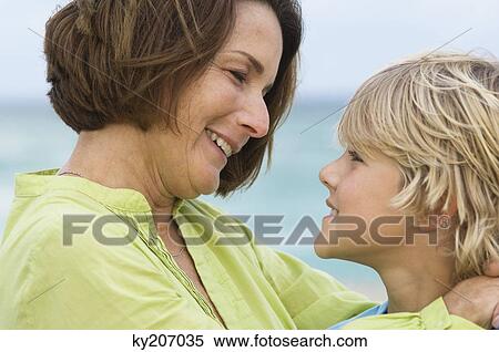 Woman smiling with her grandson View Large Photo Image Stock Photography - Woman smiling with her grandson. Fotosearch