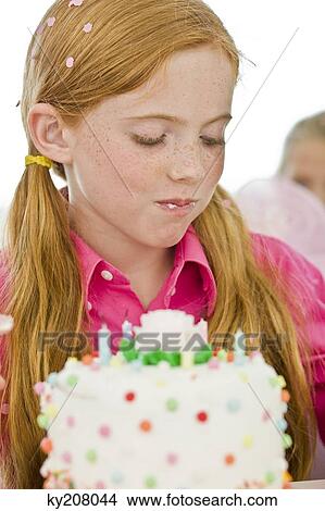 Girl eating birthday cake View Large Photo Image Picture - Girl eating birthday cake. Fotosearch