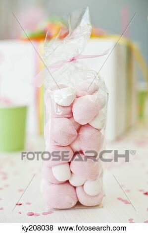 Pack of toys with a birthday present on a table View Large Photo Image Stock Photo - Pack of toys with a birthday present on a table. Fotosearch