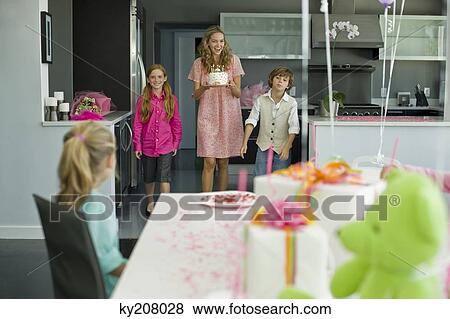 Woman with three children at a birthday party View Large Photo Image Stock Photo - Woman with three children at a birthday party. Fotosearch