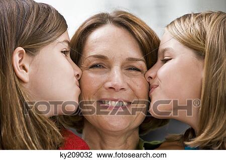 Close-up of two girls kissing their grandmother View Large Photo Image Stock Image - Close-up of two girls kissing their grandmother. Fotosearch