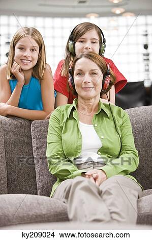 Picture - Family in a living room. Fotosearch
