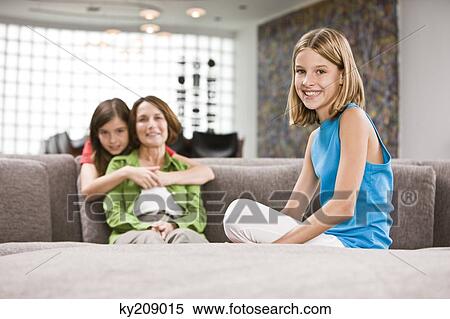 Stock Photography - Family in a living room. Fotosearch