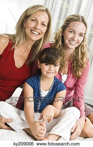 Family on the bed View Large Photo Image Stock Photograph - Family on the bed. Fotosearch