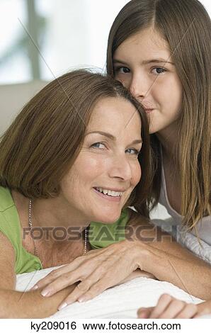 Stock Photograph - Girl kissing her grandmother. Fotosearch