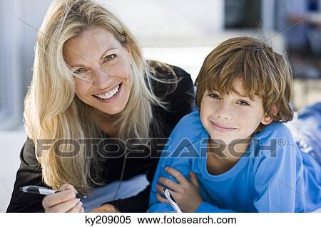 Portrait of a woman with her son View Large Photo Image Stock Photography - Portrait of a woman with her son. Fotosearch