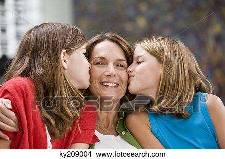 Two girls kissing their grandmother View Large Photo Image Picture - Two girls kissing their grandmother. Fotosearch