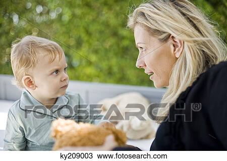 Woman playing with her son View Large Photo Image Stock Image - Woman playing with her son. Fotosearch