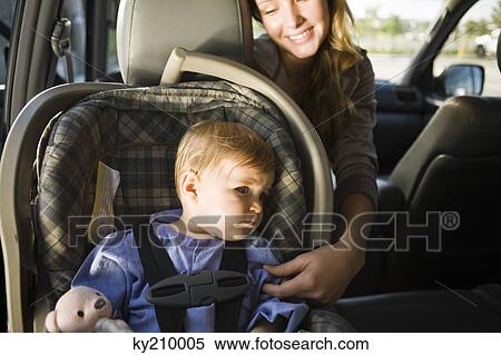 Stock Photography - Woman with her son in a car. Fotosearch