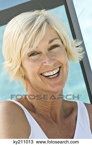 Stock Image - Portrait of a woman smiling. Fotosearch