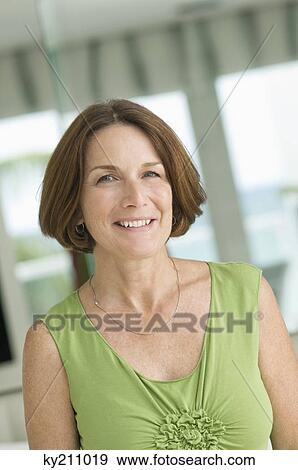 Portrait of a woman smiling View Large Photo Image Stock Photo - Portrait of a woman smiling. Fotosearch