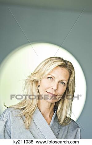 Portrait of a woman smiling View Large Photo Image Stock Photo - Portrait of a woman smiling. Fotosearch