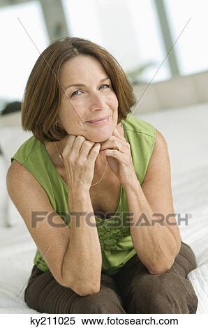 Portrait of a woman smiling View Large Photo Image Stock Photography - Portrait of a woman smiling. Fotosearch
