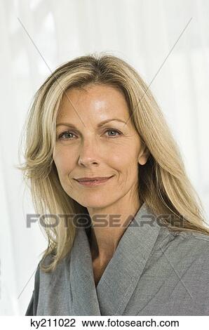 Portrait of a woman smirking View Large Photo Image Stock Image - Portrait of a woman smirking. Fotosearch