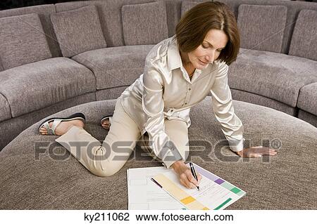 Woman filling out an application form View Large Photo Image Stock Image - Woman filling out an application form. Fotosearch