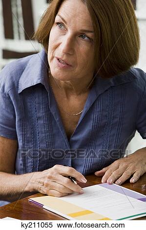 Woman filling out an application form View Large Photo Image Stock Photography - Woman filling out an application form. Fotosearch