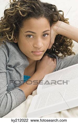 Portrait of a girl reading a book View Large Photo Image Stock Image - Portrait of a girl reading a book. Fotosearch