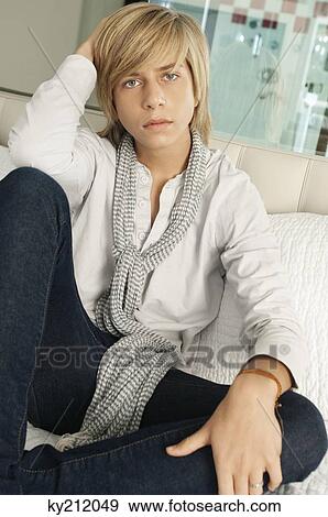Stock Photo - Portrait of a teenage boy looking serious. Fotosearch