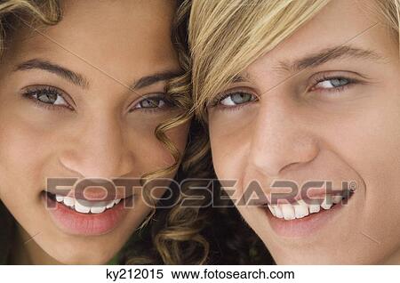 Portrait of a teenage boy smiling with a girl View Large Photo Image Stock Photography - Portrait of a teenage boy smiling with a girl. Fotosearch