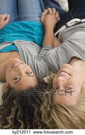 Teenage boy holding hand of a girl View Large Photo Image Stock Image - Teenage boy holding hand of a girl. Fotosearch
