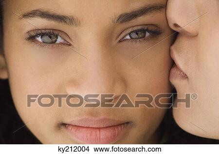 Picture - Teenage boy kissing a girl. Fotosearch