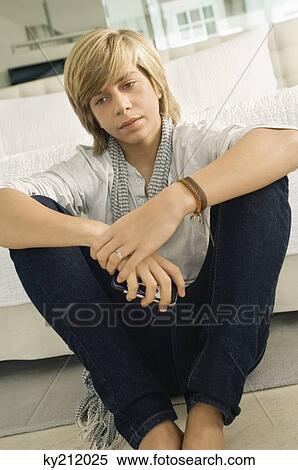 Stock Photography - Teenage boy thinking. Fotosearch