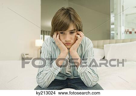 Boy looking serious View Large Photo Image Picture - Boy looking serious. Fotosearch