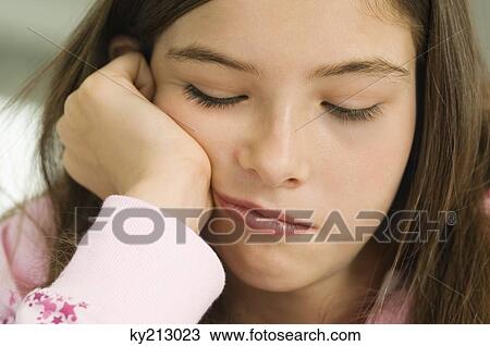 Close-up of a girl thinking View Large Photo Image Stock Image - Close-up of a girl thinking. Fotosearch