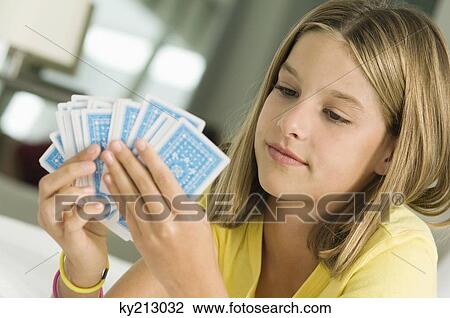 Girl holding playing cards View Large Photo Image Stock Image - Girl holding playing cards. Fotosearch