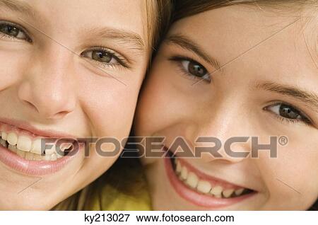 Portrait of two girls smiling View Large Photo Image Stock Photo - Portrait of two girls smiling. Fotosearch
