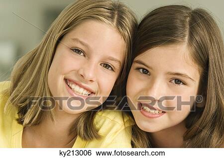 Portrait of two girls smiling View Large Photo Image Stock Photograph - Portrait of two girls smiling. Fotosearch