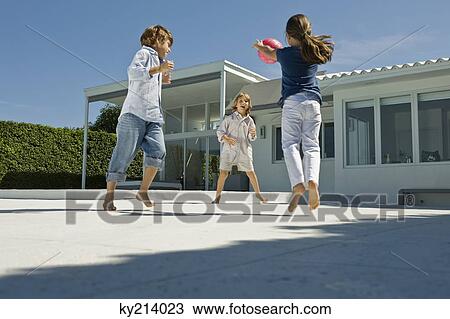 Children playing with a ball View Large Photo Image Stock Image - Children playing with a ball. Fotosearch